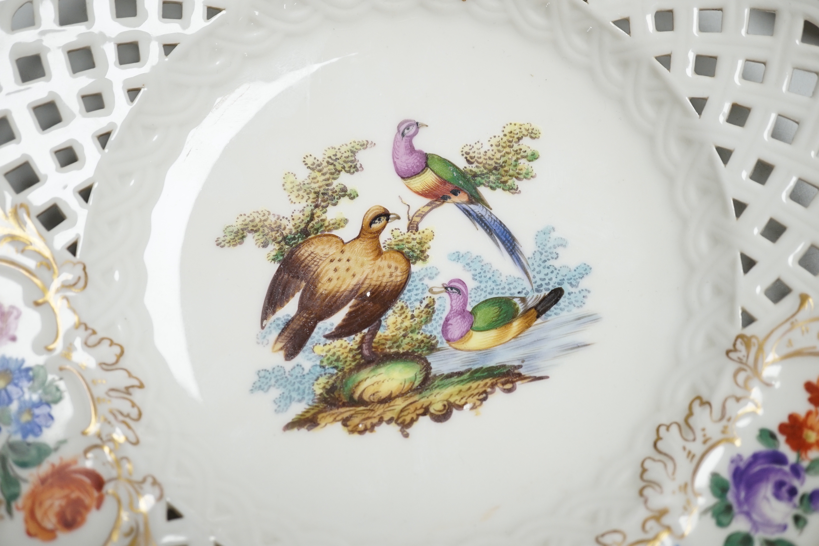 A pair of Meissen outside-decorated bird and flower dishes, 23cm diameter
